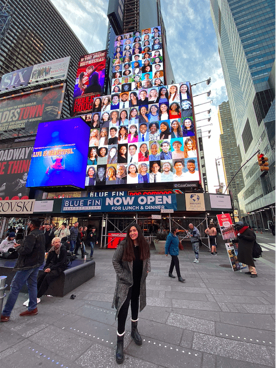 Hanya Noussier standing in Times Square. 