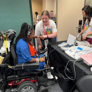 SCSD student interacting with a Special Olympics athlete during their hearing exam.