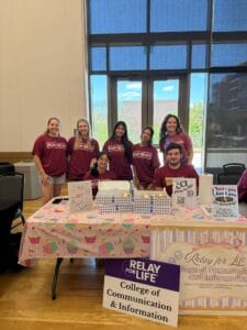CCI team standing at fundraising table